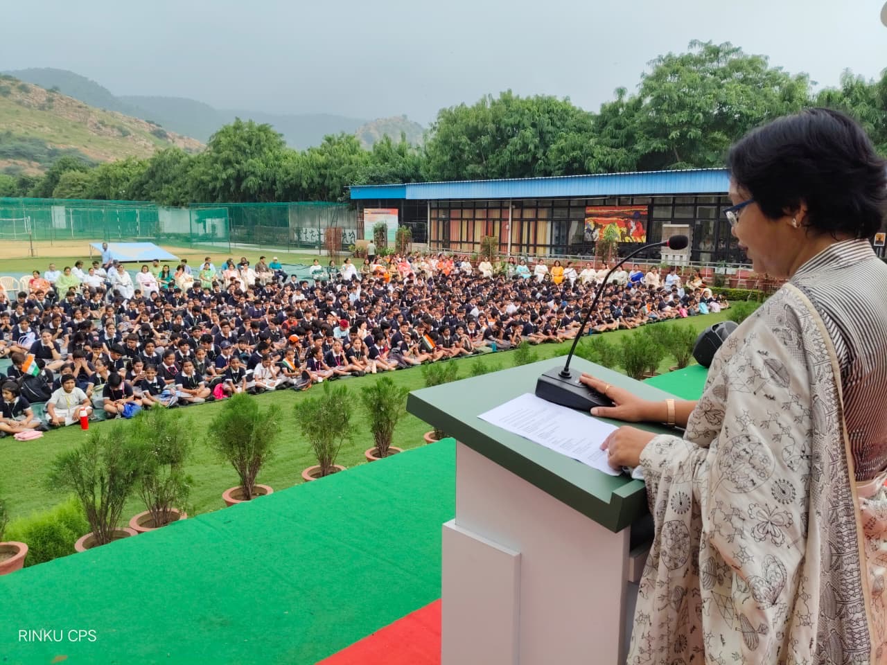 The principal addressing students during morning assembly at Chinar Public School