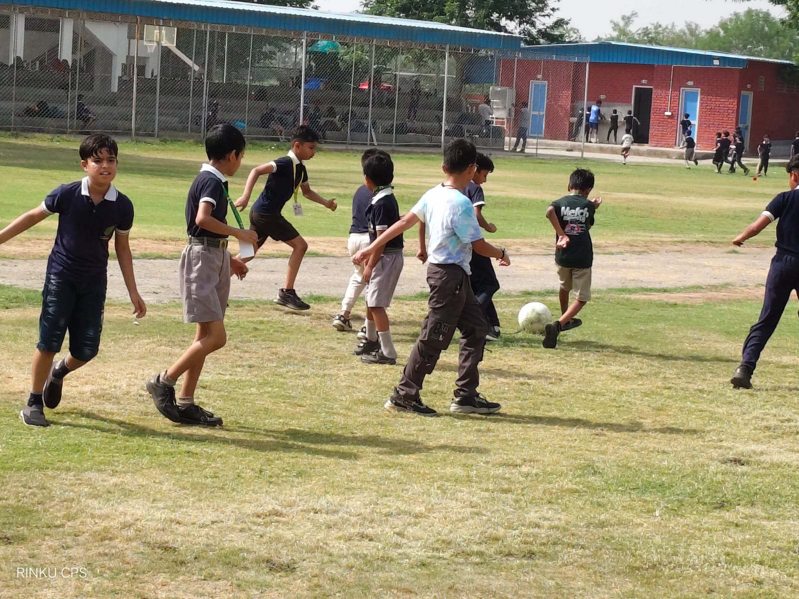 Students playing football at Chinar Public School